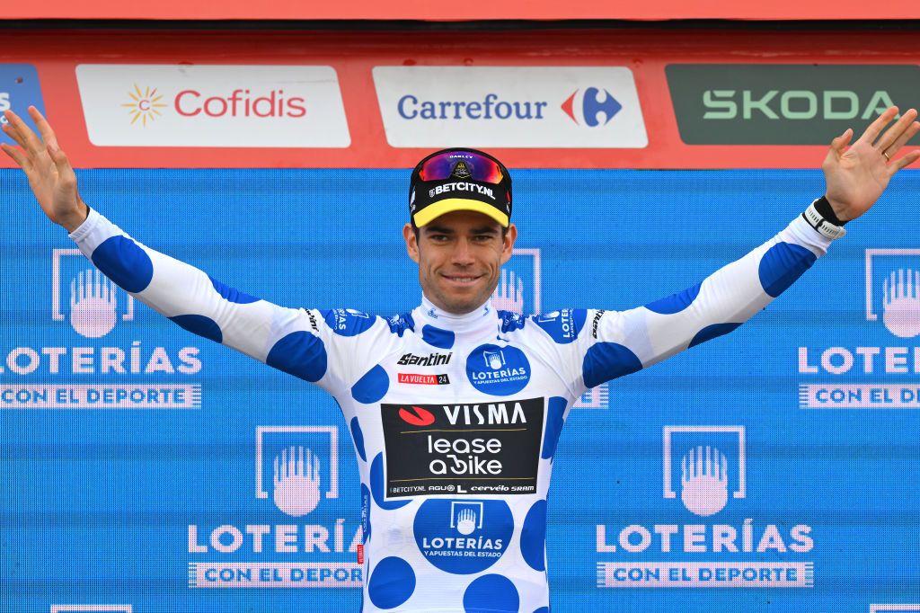 PUERTO DE ANCARES SPAIN AUGUST 30 Wout van Aert of Belgium and Team Visma Lease a Bike celebrates at podium as Polka Dot Mountain Jersey winner during the La Vuelta 79th Tour of Spain 2024 Stage 13 a 176km stage from Lugo to Puerto de Ancares 1659m UCIWT on August 30 2024 in Puerto de Ancares Spain Photo by Tim de WaeleGetty Images