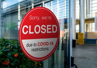 Business with a closed sign due to COVID-19.