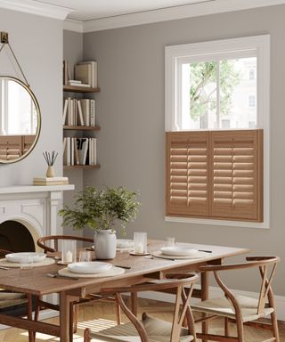 neutral dining room with oak cafe style window shutters