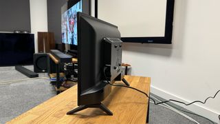 RCA Roku TV 24-inch (RK24HF1) small TV side angle on wooden TV bench in test room