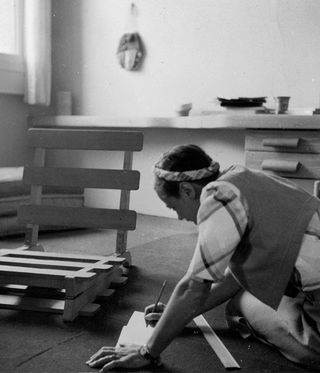 black and white image of Charlotte Perriand working in Japan