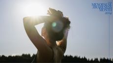 Woman with arms above her head looking into the sun, representing one way to deal with PCOS and menopause