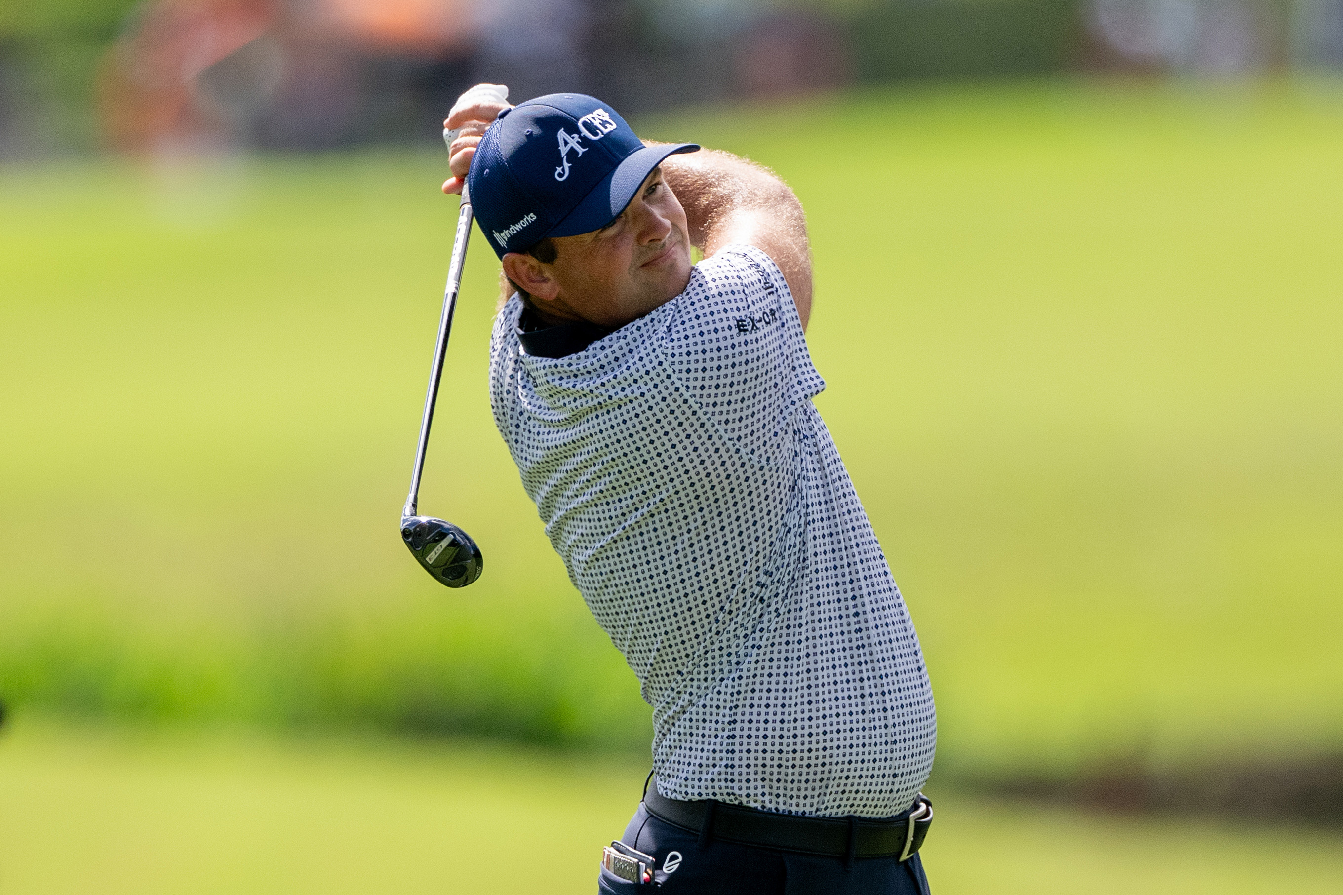 Patrick Reed holds his finish after playing a hybrid shot
