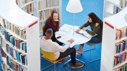 University students working in library