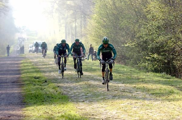 Europcar riders get acquainted with the Arenberg Forest cobbles.