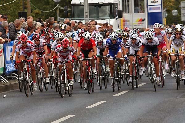Emma Johansson (left) and her Red Sun Cycling team react to an acceleration by Charlotte Becker (Equipe Nurnberger).