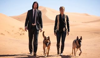 Keanu Reeves and Halle Berry and Sofia dogs in John Wick Chapter 3 Parabellum