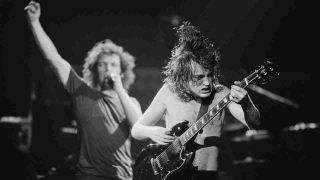 AC/DC’s Brian Johnson and Angus Young performing onstage in 1980