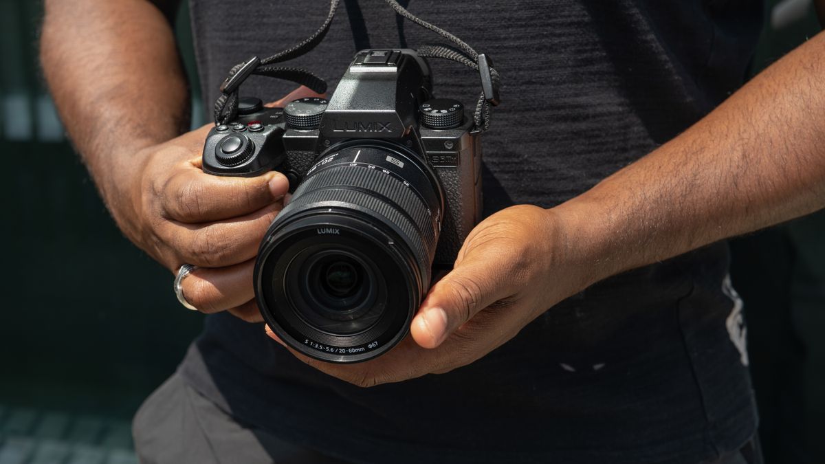 Panasonic Lumix S5 IIX being held by DCW reviewer Jon Devo