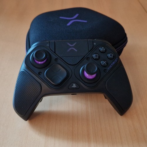 Victrix Pro BFG controller with case on a wooden table
