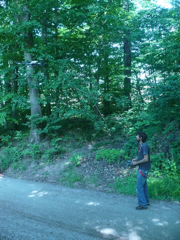 A man flies a video camera via remote control.