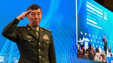 General Li Shangfu salutes the audience at the Shangri-La Dialogue summit in Singapore on 4 June, 2023