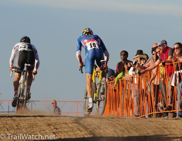 Alex Candelario (World Bicycle Relief) attacking Danny Summerhill with one lap to go