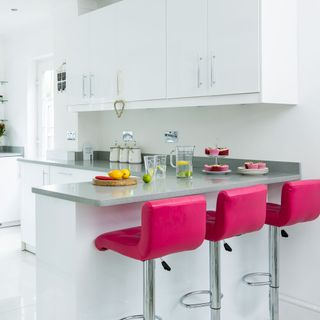 kitchen with white wall rose pink chair