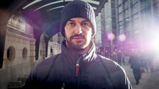 Young man, in urban street, winter, wearing wool hat,