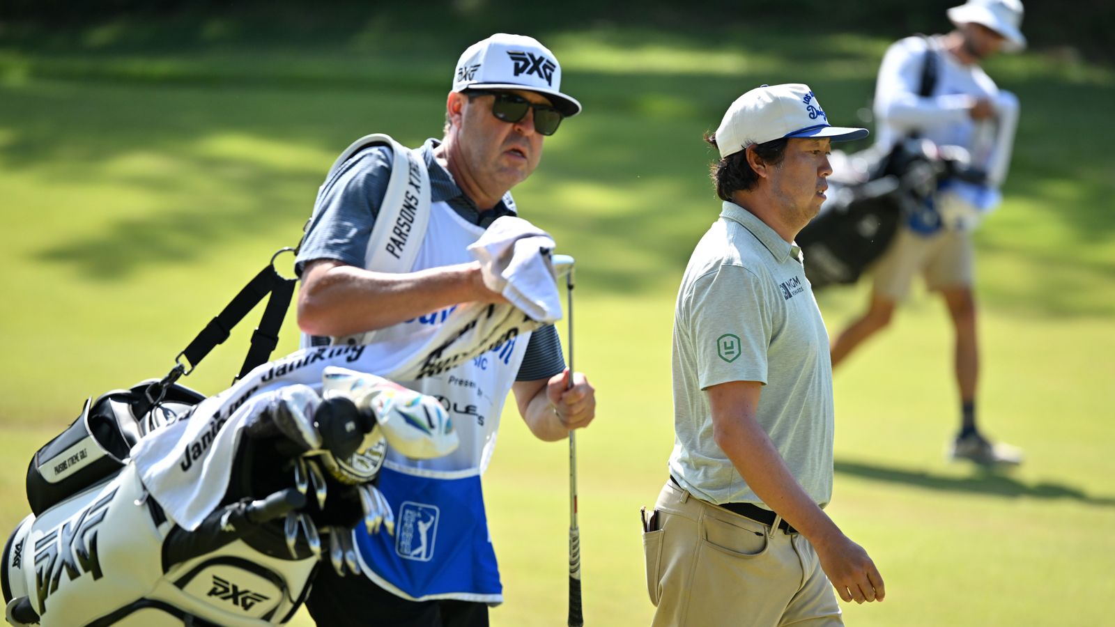 David Lipsky and his caddie walk off the green