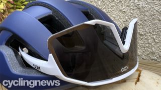 A pair of Koo sunglasses fitted into the eyewear slots on the POC Omne Air Spin helmet
