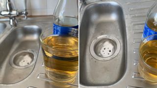 Stainless steel kitchen sink with a cup of measures vinegar ready to clean the kitchen sink drain