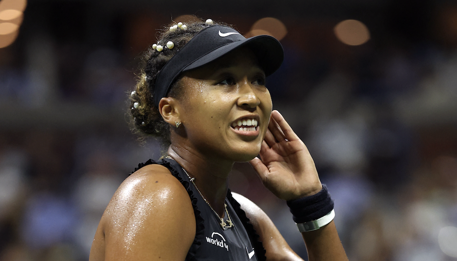 Naomi Osaka plays her second match at the 2024 us tennis open wearing pearls in her hair and bows on her outfit