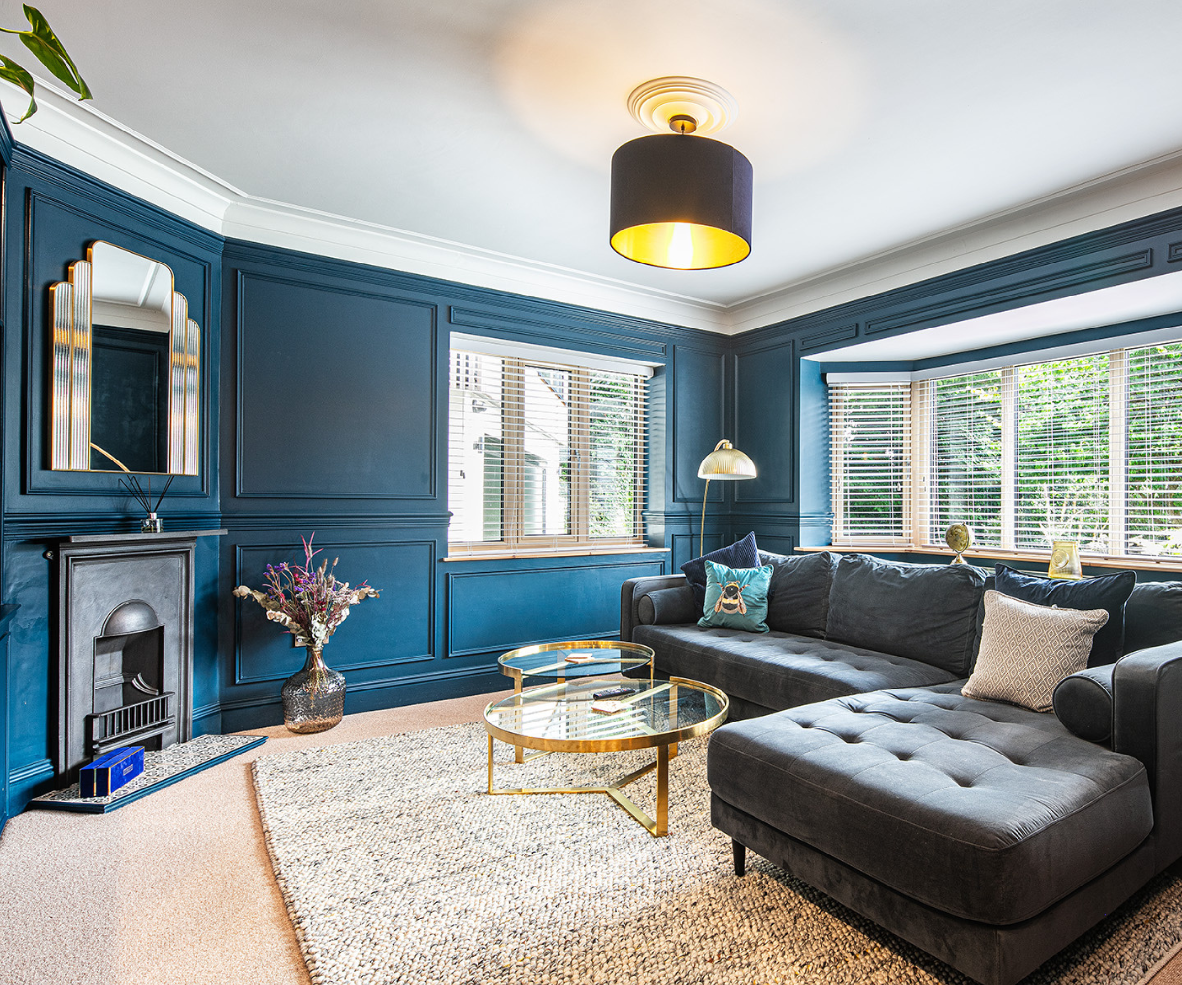 Living room with blue panelled walls
