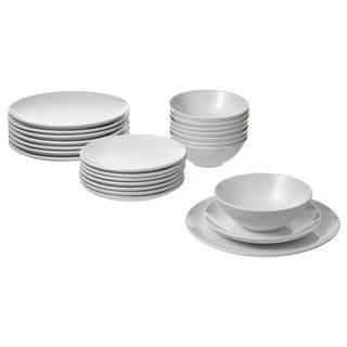 Stacked white plates and bowls