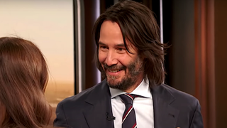 Keanu Reeves smiles at Drew Barrymore on The Drew Barrymore Show.