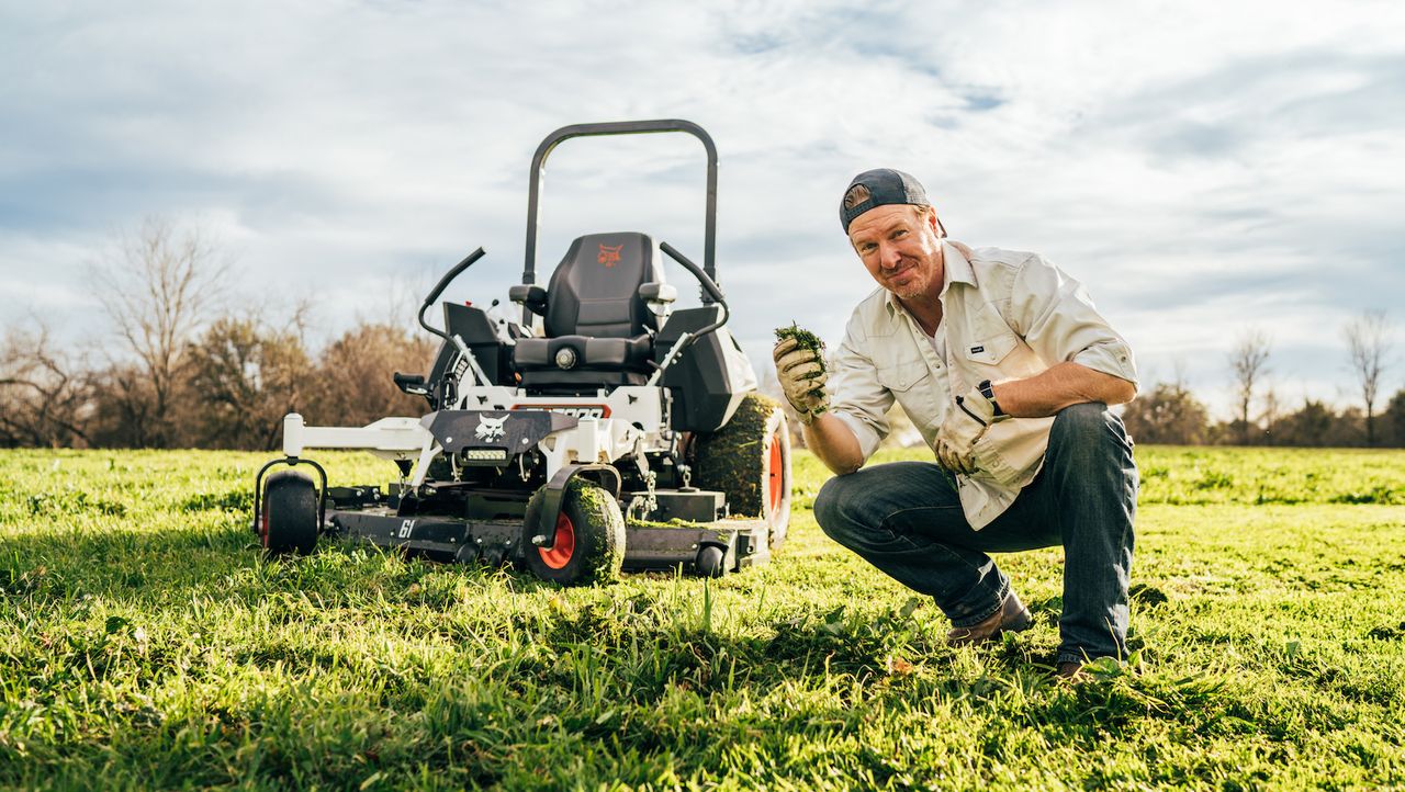 Chip Gaines outside next to Bobcat lawn equipment