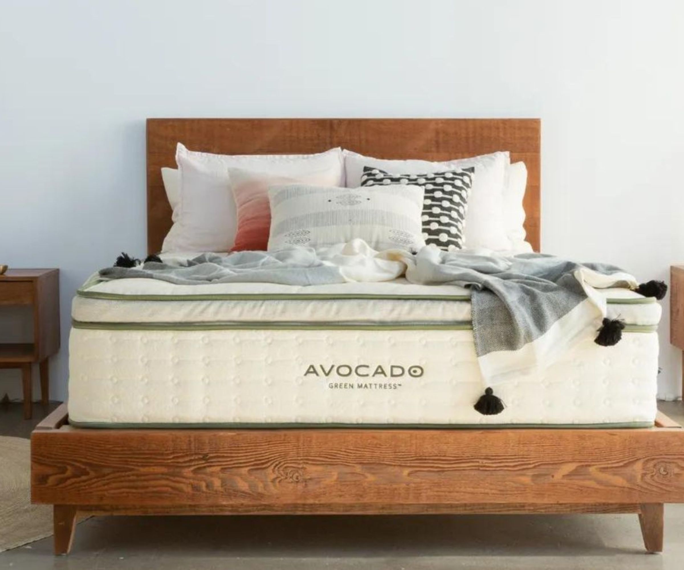 Cushions and blankets on the Avocado Green Mattress.