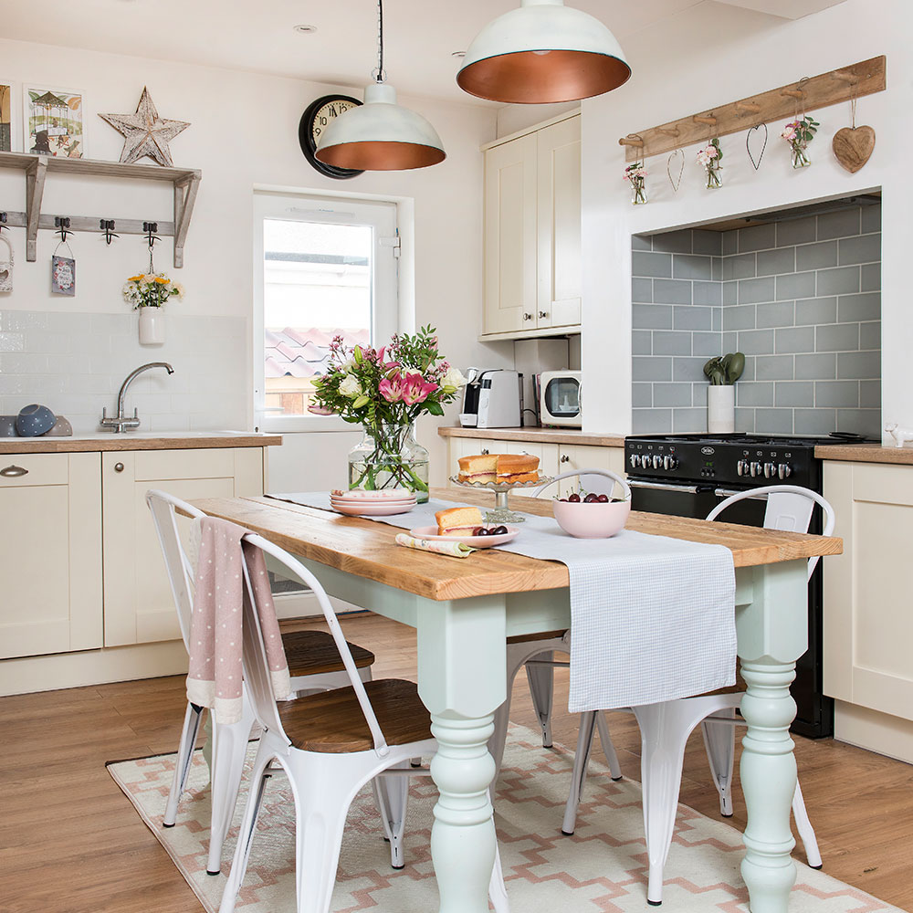 kitchen and dining area with wooden flooring and dining set and wooden cabinets