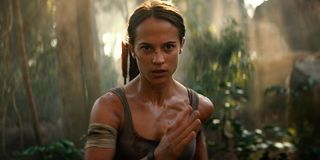Lara Croft running through the jungle in Tomb Raider
