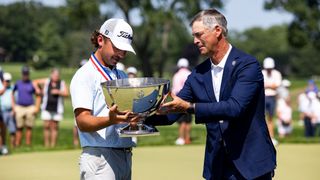 Trevor Gutschewski is handed the US Junior Amateur trophy