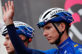 Team Deceuninck rider Portugals Joao Almeida waves from the presentation podium prior to take the start of the fourth stage of the Giro dItalia 2021 cycling race 187 km between Piacenza and Sestola EmiliaRomagna on May 11 2021 Photo by Luca Bettini AFP Photo by LUCA BETTINIAFP via Getty Images