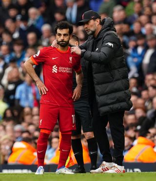 Liverpool manager Jurgen Klopp speaks to Mohamed Salah on the touchline
