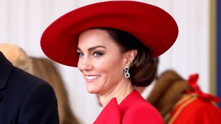 Kate Middleton wearing a red hat