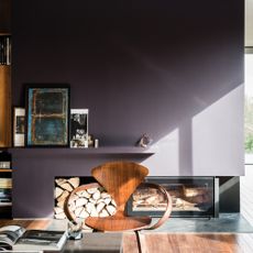 Paean black living room with wooden design armchair