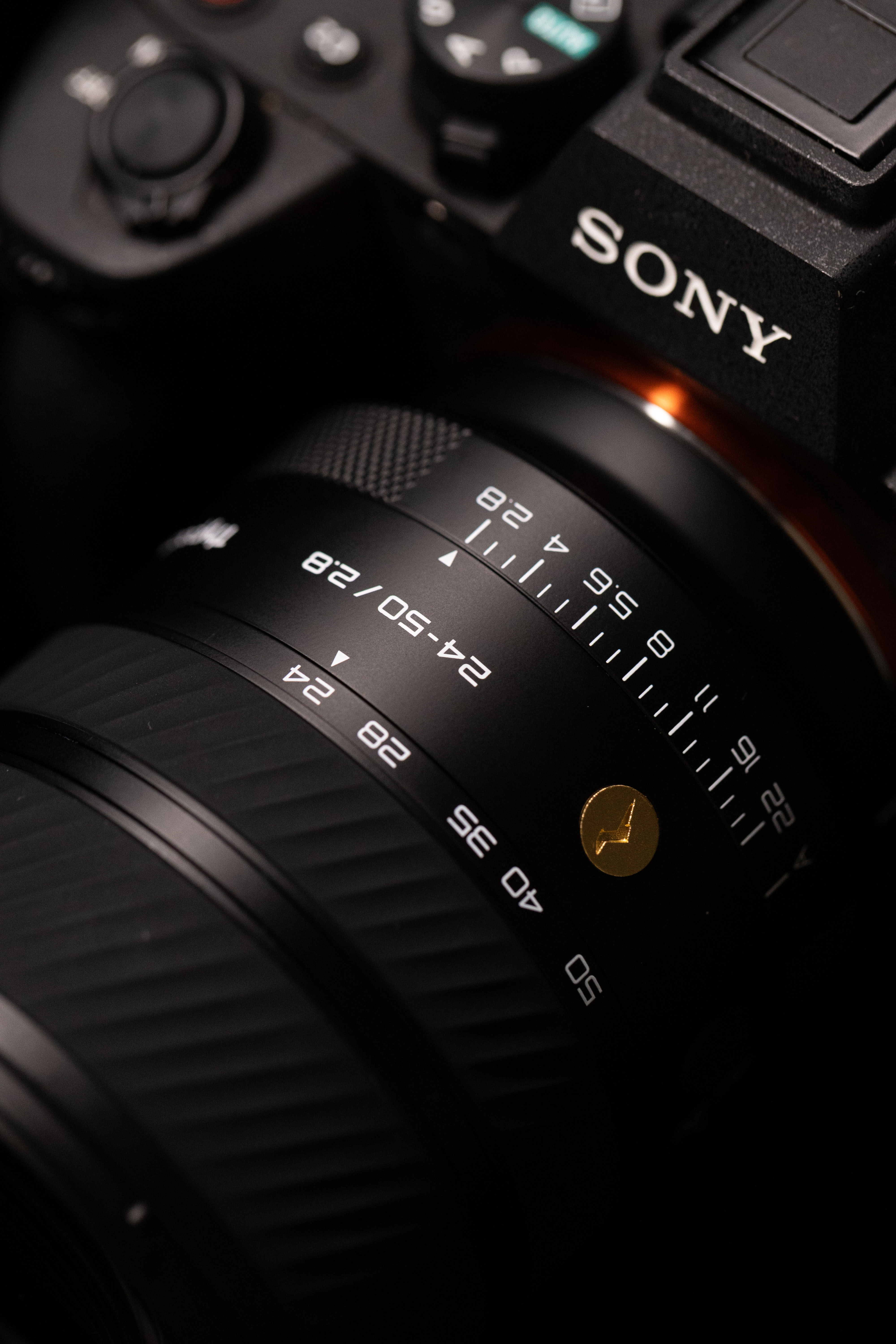 A close-up photo of the new Thypoch Voyager 24-50mm f/2.8