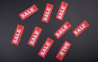 A selection of Sale tags against a dark background