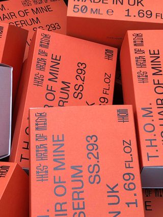 Boxes of T.H.O.M Scalp Serum