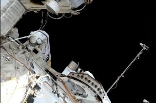 Russian cosmonaut Dmitry Petelin is seen at aft end of the Zvezda service module outside of the International Space Station during a spacewalk on June 22, 2023.