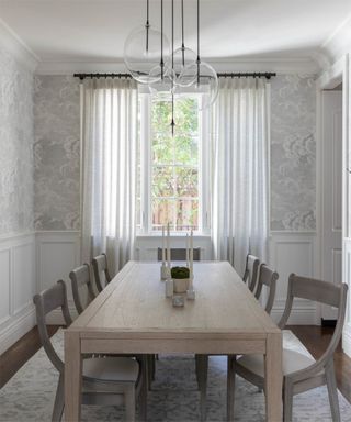 Calm dining room with cloud wallpaper by Susie Novak Interiors