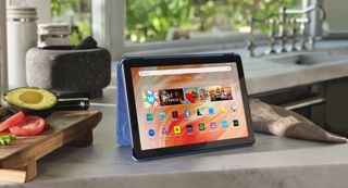 The Amazon Fire HD 10 sitting on a kitchen counter.