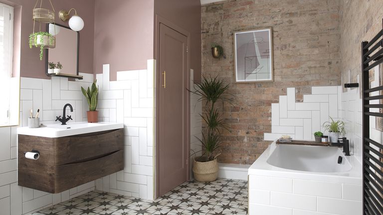 Bathroom with pink and brick walls, white metro tiles, wall-hung vanity unit and patterned tile flooring