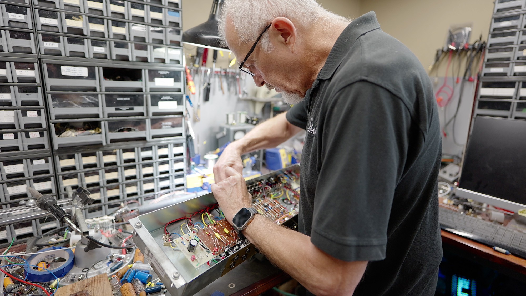John Suhr at work on a guitar amp