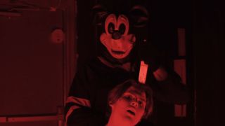 Mickey Mouse stabbing somebody in the head in The Mouse Trap