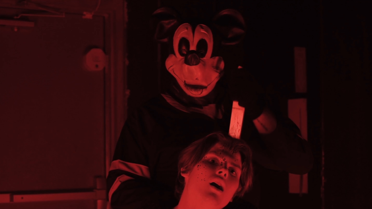 Mickey Mouse stabbing somebody in the head in The Mouse Trap