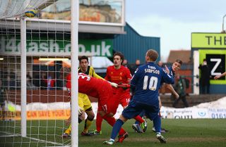 OLDHAM, ENGLAND - JANUARY 27: Martin Skrtel of Liverpool scores an own goal during the FA Cup with Budweiser Fourth Round match between Oldham Athletic and Liverpool at Boundary Park on January 27, 2013 in Oldham, England. (Photo by Matthew Lewis/Getty Images)