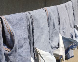 Jeans turned inside out drying on clothesline