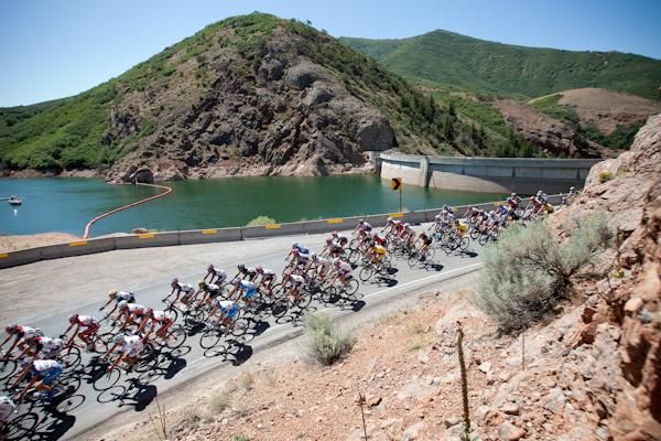 Riders pass by a dam along the route.