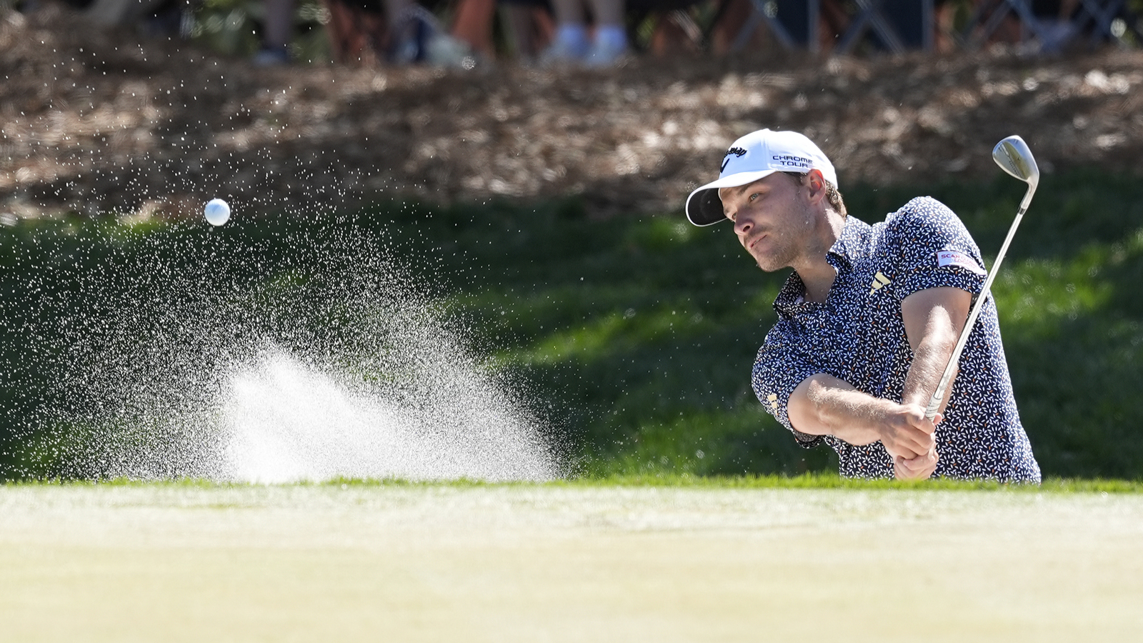 Rasmus Hojgaard hits a bunker shot