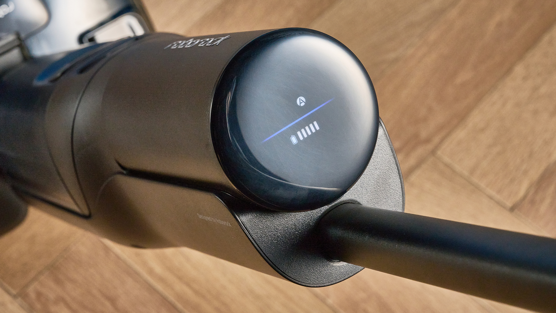 Roborock F25 ACE Pro photographed on a brown wood floor